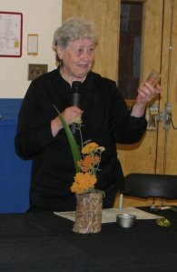 hollowed log with glass vase inside